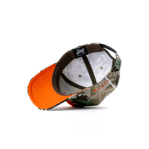 Flat lay of DadGang DadTree Camo Trucker Hat in Orange showcasing the camo crown, front logo embroidery, and high-contrast orange brim and mesh