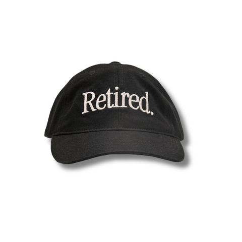 Front view of Duvin Retired Hat in Black featuring a low-profile crown and white embroidered "Retired" text on the front panel