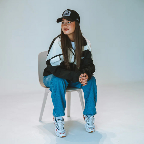 Person wearing the Huega House Circuit Hat in Black in a modern, urban or active setting