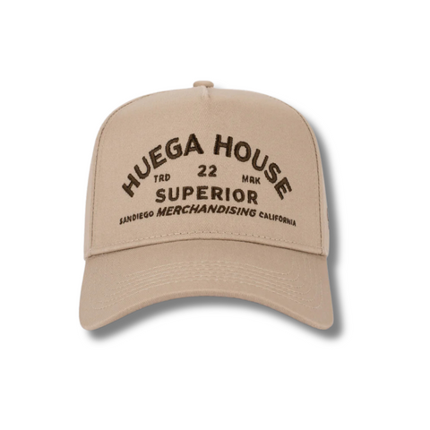 Front view of Huega House Trademark Hat in Khaki featuring the Huega House logo embroidery on a structured crown with a classic curved brim