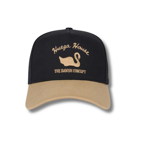 Front view of Huega House Vintage Swan Hat in Black and Khaki featuring a retro swan patch on a structured black crown with a contrasting khaki curved brim