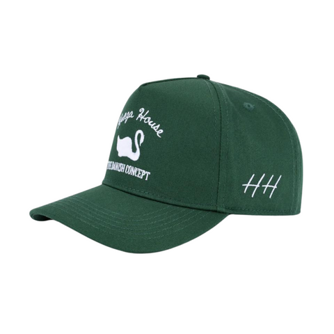 Side view of Huega House Vintage Swan Hat in Forest Green showing tonal color design, curved brim, and breathable mesh panels