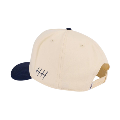 Back view of Huega House Vintage Swan Hat in Navy and Natural with adjustable snapback closure and white mesh back for ventilation