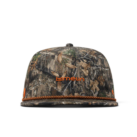 Front view of Melin Coronado Real Tree Hydro Hat in Edge featuring a structured crown, Real Tree camo pattern, and tonal logo patch