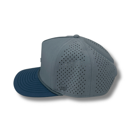 Side view of Melin Hydro Odyssey Rope Bulls Icon Hat in Blue Horizon / Pacific Ocean showing curved brim, breathable panels, and lightweight water-repellent fabric