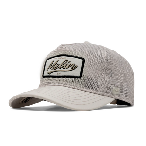 Side view of Melin Odysea Mac Retro Hydro in Moon showing curved brim, tonal stitching, and lightweight, water-resistant panels