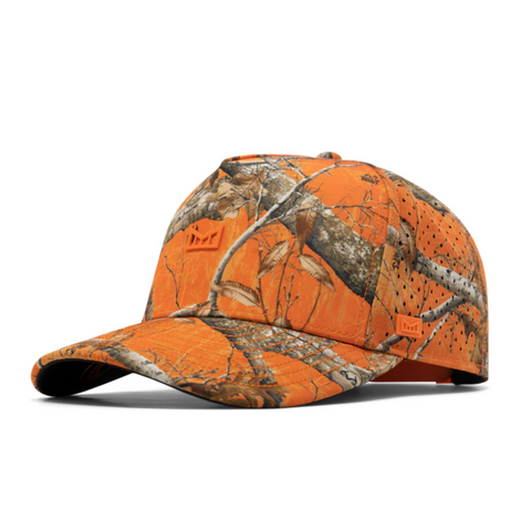 Side view of Melin Odyssey Real Tree Hydro Hat in Neon Camo showing water-resistant panels, curved brim, and moisture-wicking tech fabric