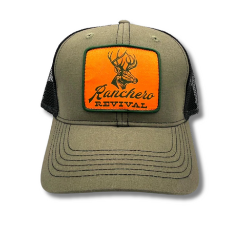Front view of Ranchero Revival Buck Trucker Hat in olive and black featuring embroidered buck patch on structured front panel