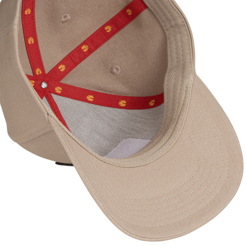 Flat lay of Sendero Cowboy Pro Shop Hat in Tan highlighting retro patch design, contrast brim, and classic trucker silhouette