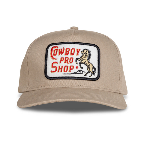Front view of Sendero Cowboy Pro Shop Hat in Tan featuring a structured crown and embroidered vintage-style Cowboy Pro Shop graphic patch