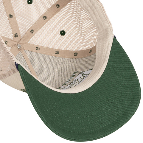 Flat lay of Sendero Skinny Cows Hat in Cream/Green highlighting the novelty patch, structured crown, and two-tone Western-inspired design