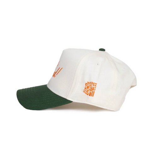 Side view of State Forty Eight Frame Snapback in Natural & Forest showing curved forest green brim and two-tone crown