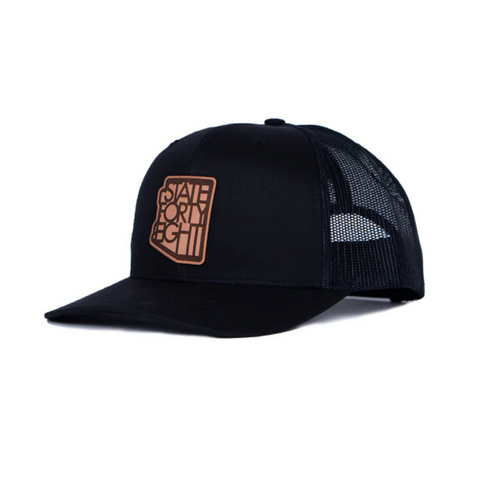 Side view of State Forty Eight Classic Snapback in Black & Brown showing contrast brown curved brim and mesh back panel