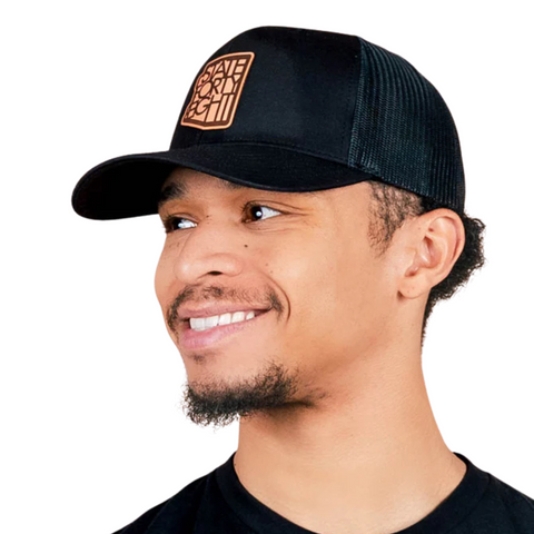 Side view of State Forty Eight Classic Snapback in Black & Brown showing contrast brown curved brim and mesh back panel