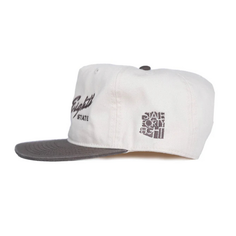 Side view of The Forty Eighth State Snapback in Natural & Walnut showing contrasting walnut brim and breathable mesh back
