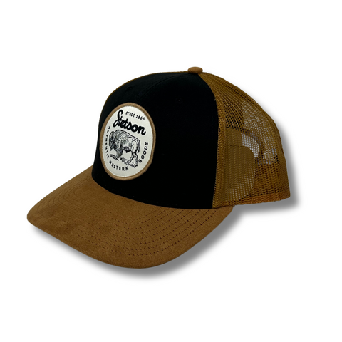 Side angle of the Stetso Bison Patch Hat showing the curved brim and profile of the structured front and breathable mesh back.