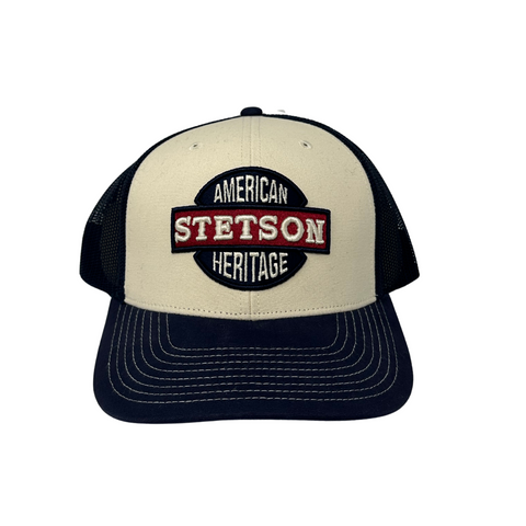 Front view of the Stetson Men's American Heritage Patch Trucker Cap featuring a vintage-inspired embroidered patch on the structured crown.