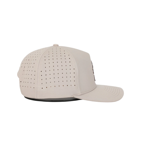 Side view of Waggle Wally Hat in Tan showing breathable mesh side panels, performance fit, and mid-profile shape