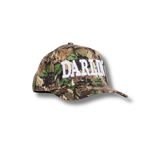Front view of DARLIN' Cap in White Heritage Camo featuring bold embroidered "DARLIN'" text on a structured crown with camo print paneling