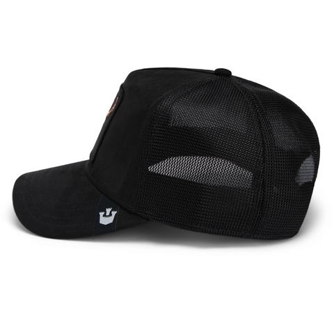 Side angle of the black Goorin Bros "The Suede Skull" hat showing the curved brim and mesh back for breathable comfort.