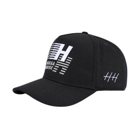 Side view of Huega House Legacy Hat in Black showing clean mid-profile fit, tonal stitching, and performance-style construction