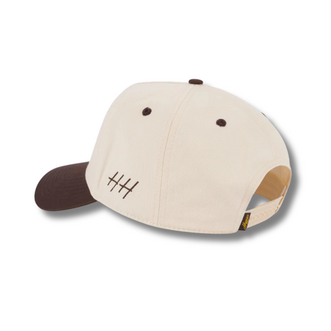 Back view of Huega House Legacy Hat in Brown and Natural with adjustable strap closure and metal buckle for a custom fit