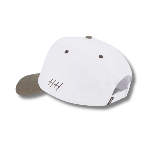 Back view of Huega House Legacy Hat in Cement and White with adjustable strap and metal buckle for a secure and customizable fit