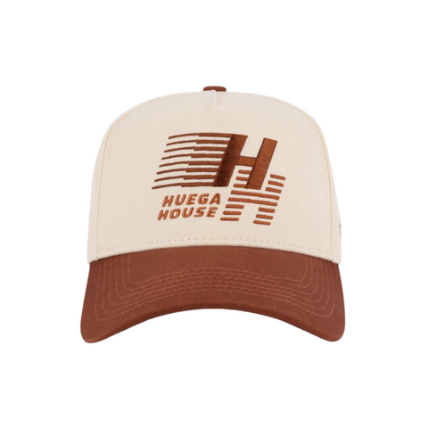 Front view of Huega House Legacy Hat in Rust featuring embroidered "Huega House Legacy" text on a structured crown with a curved brim and rich rust tone