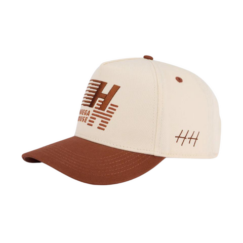 Side view of Huega House Legacy Hat in Rust showing soft, mid-profile fit with tonal stitching and casual athletic style