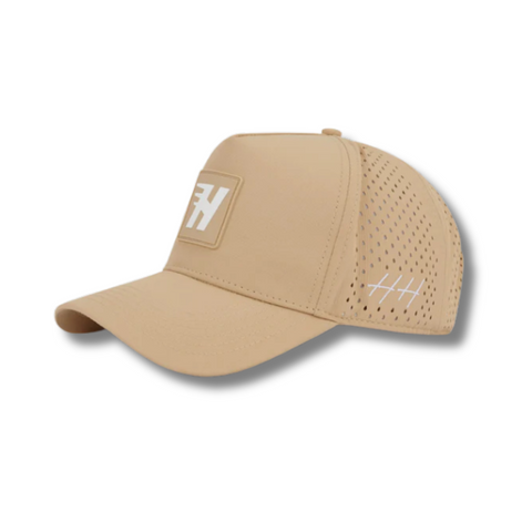 Side view of Huega House Success Performance Hat in Khaki showing breathable side panels, curved brim, and lightweight performance fabric