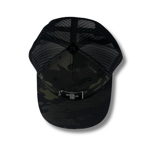 Close-up of tonal cactus patch embroidery and black camo fabric on the Local Stated Cactus Stated Hat