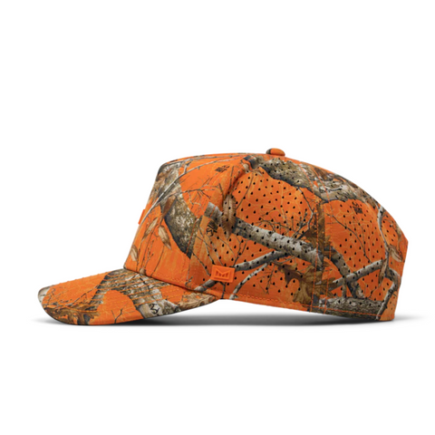 Side view of Melin Odyssey Real Tree Hydro Hat in Neon Camo showing water-resistant panels, curved brim, and moisture-wicking tech fabric