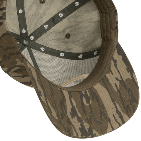 Flat lay of Sendero Cowboy Country Club Hat in Mossy Oak highlighting camo fabric, front patch, and curved brim