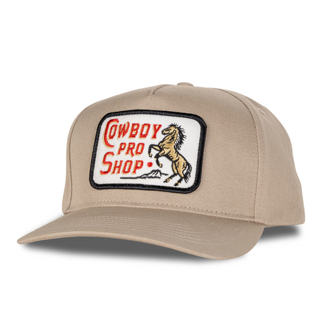 Front view of Sendero Cowboy Pro Shop Hat in Tan featuring a structured crown and embroidered vintage-style Cowboy Pro Shop graphic patch
